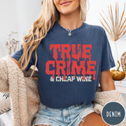 Comfort Colors tee in Denim featuring red dripping text graphic that says True Crime and Cheap Wine