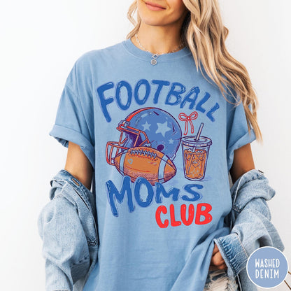 Comfort Colors tee in Washed Denim featuring football mom lifestyle graphic with helmet, football, and iced coffee