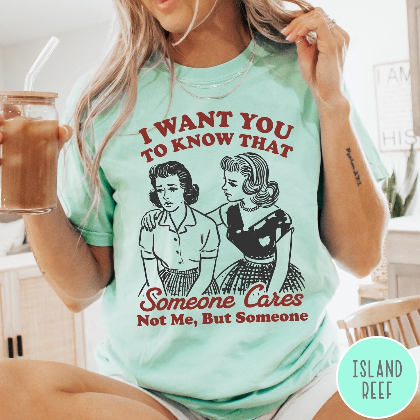 Comfort Colors tee in Island Reef featuring vintage style graphic of two women comforting each other with text
