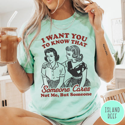 Comfort Colors tee in Island Reef featuring vintage style graphic of two women comforting each other with text