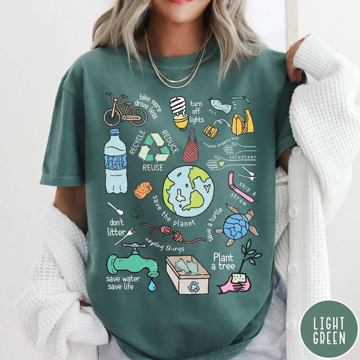 Comfort Colors tee in Light Green featuring environmental awareness graphic with icons for recycling, saving water, and nature.