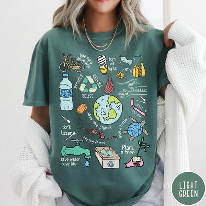 Comfort Colors tee in Light Green featuring environmental awareness graphic with icons for recycling, saving water, and nature.