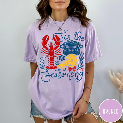 Comfort Colors tee in Orchid featuring lobster boil graphic with lobster, pot, and lemon slices