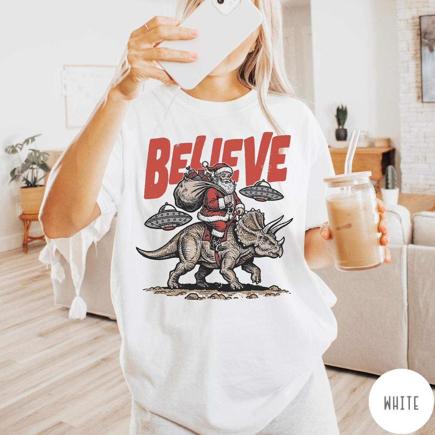 Comfort Colors tee in White featuring vintage style graphic of Santa riding a dinosaur with flying saucers