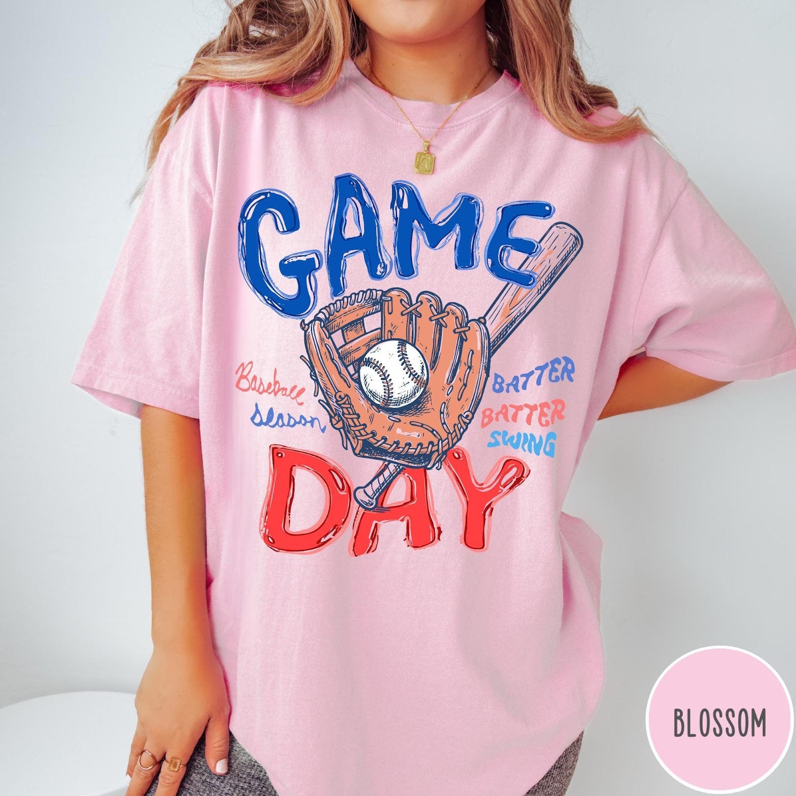 Comfort Colors tee in Blossom featuring baseball design with glove, ball, bat, and Game Day text graphic