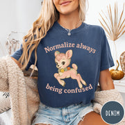 Comfort Colors tee in Denim featuring vintage style fawn graphic with flowers and Normalize Always Being Confused text