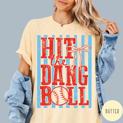 Comfort Colors tee in Butter featuring baseball design with red text and a blue striped background graphic