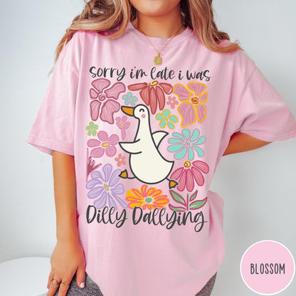 Comfort Colors tee in Blossom featuring cute duck graphic with colorful flowers and Sorry I Was Dilly Dallying text