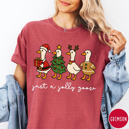 Comfort Colors tee in Crimson featuring festive geese graphic with Santa, Christmas tree, reindeer, and gingerbread goose designs