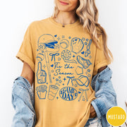 Comfort Colors tee in Mustard featuring baseball game day graphic with bat, helmet, and game day text