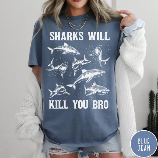 Comfort Colors tee in Blue Jean featuring illustrative style graphic of multiple sharks and text Sharks Will Kill You