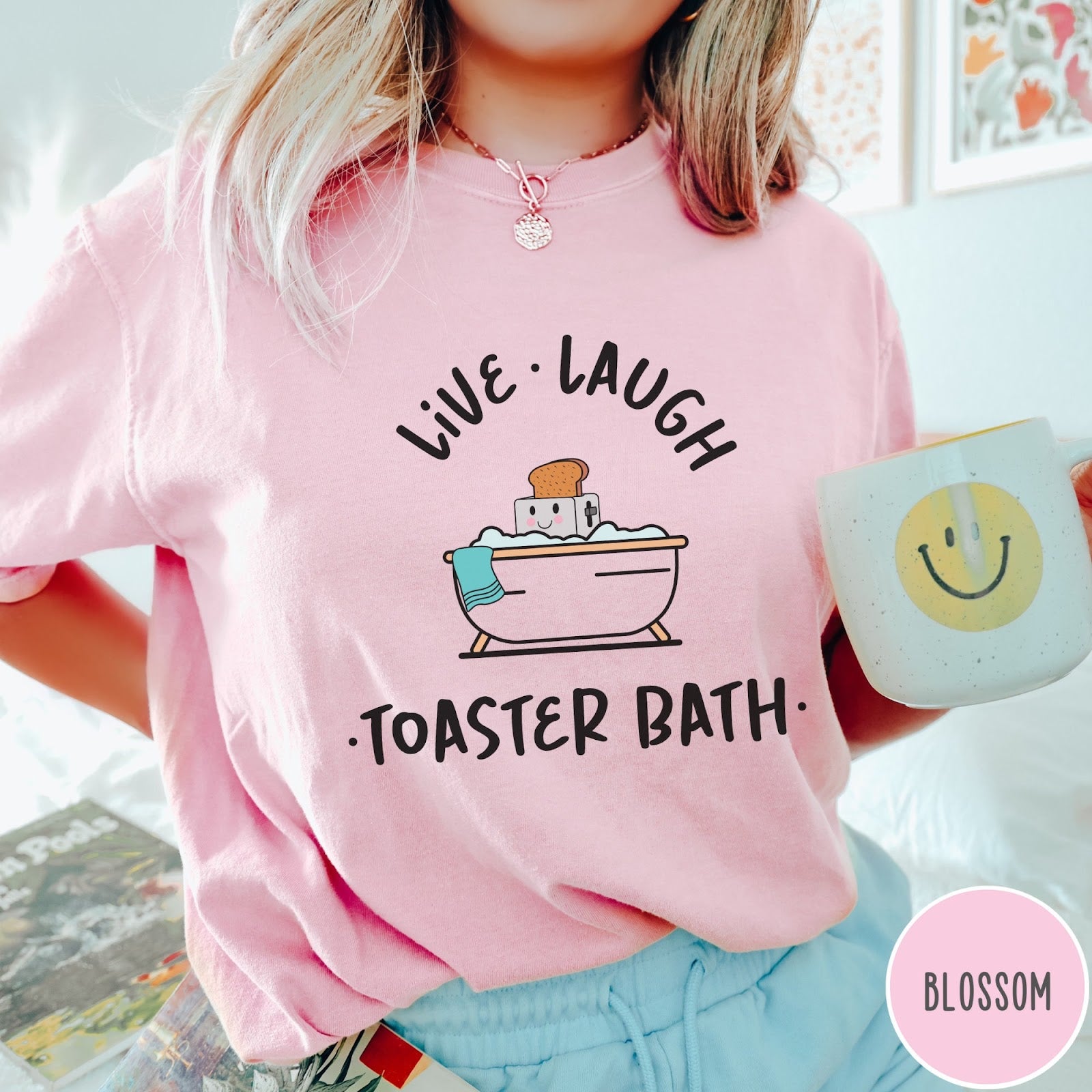 Comfort Colors tee in Blossom featuring cute graphic style of a smiling toaster sitting in a bathtub