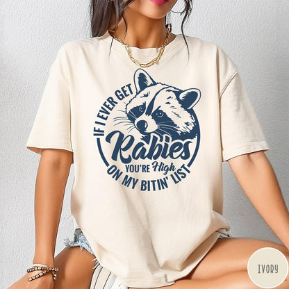Comfort Colors tee in Ivory featuring raccoon graphic with text If I Ever Get Rabies You're High On My Bitin' List