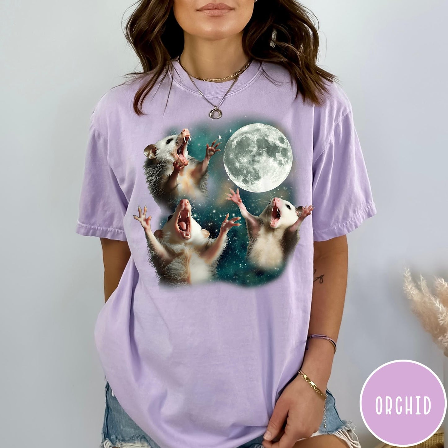 Comfort Colors tee in Orchid featuring vintage graphic style with three screaming possums reaching for the moon