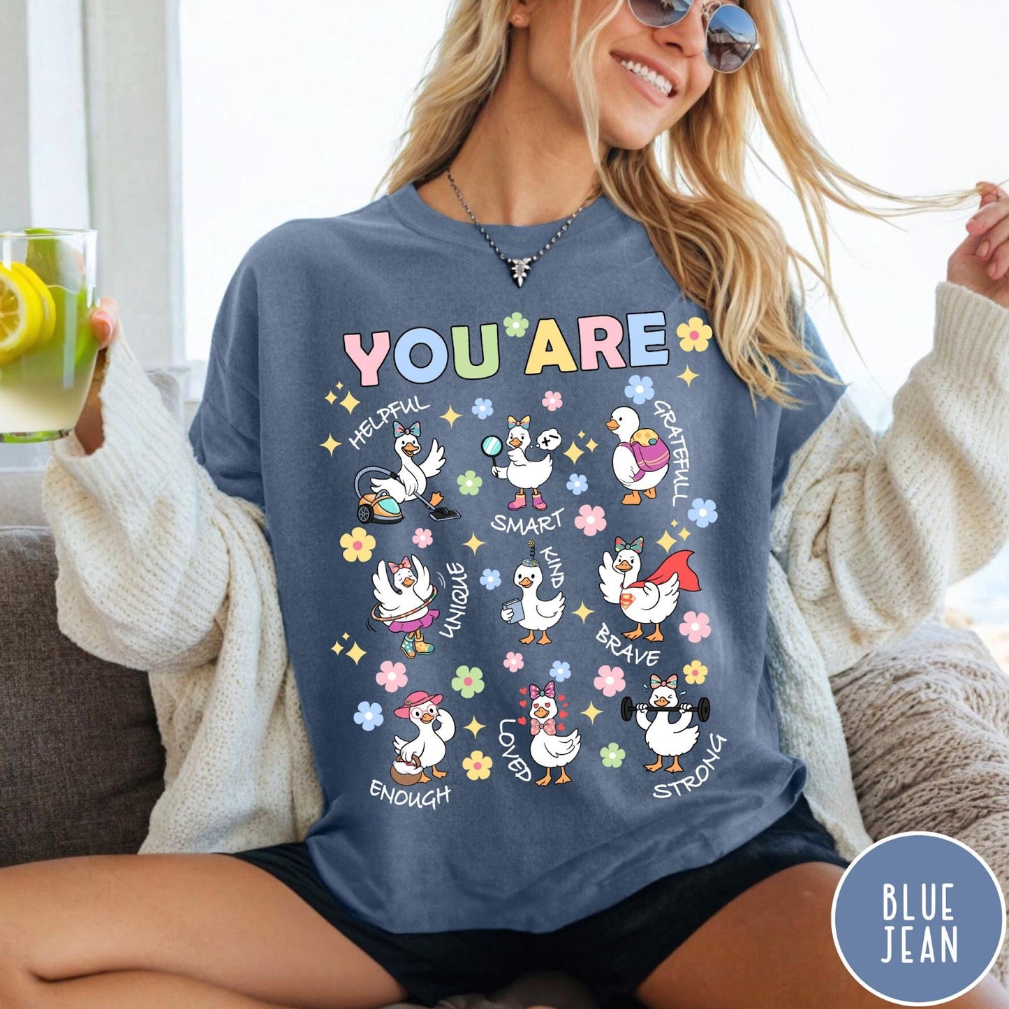 Comfort Colors tee in Blue Jean featuring cute cartoon duck graphic with inspirational words like kind and brave