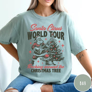 Comfort Colors tee in Bay featuring vintage style Santa Claus playing electric guitar by a Christmas tree
