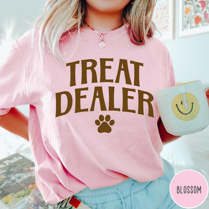 Comfort Colors tee in Blossom featuring dog owner design style with Treat Dealer text and paw print