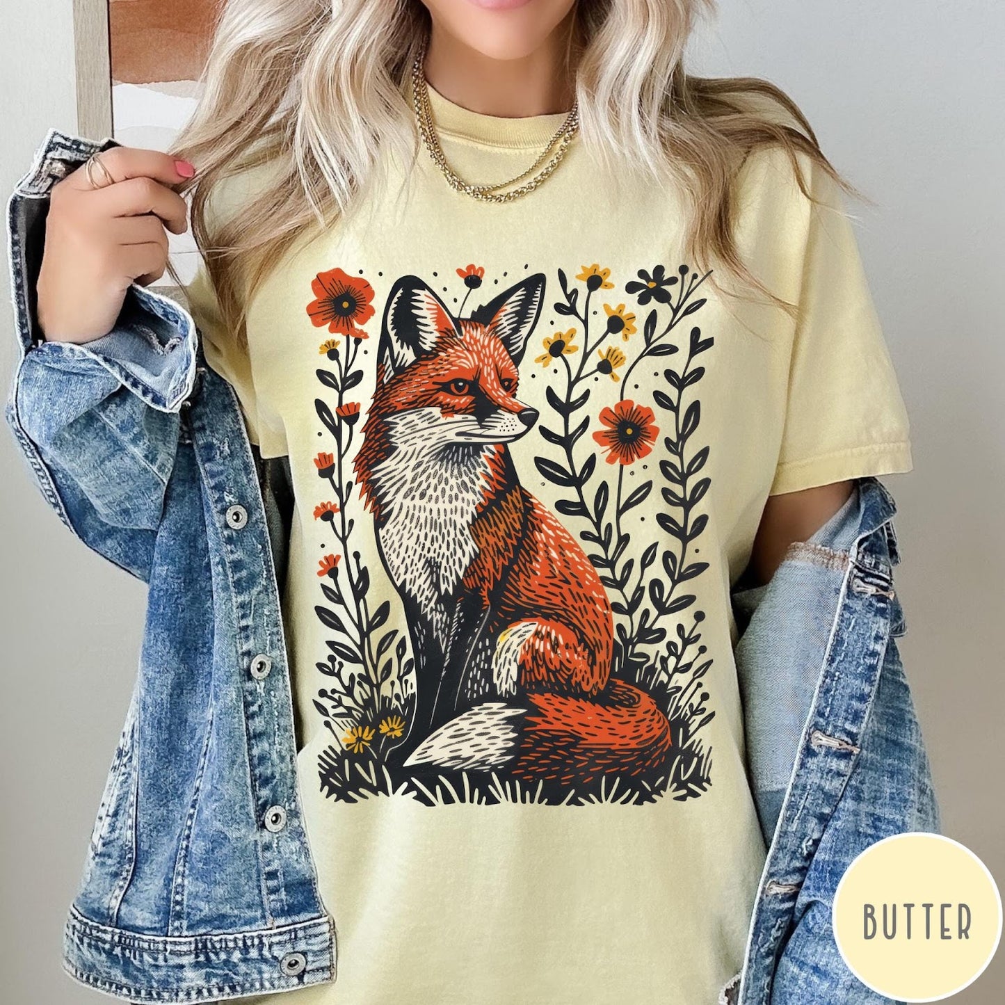 Comfort Colors tee in Butter featuring vintage style graphic of a sitting fox surrounded by orange flowers