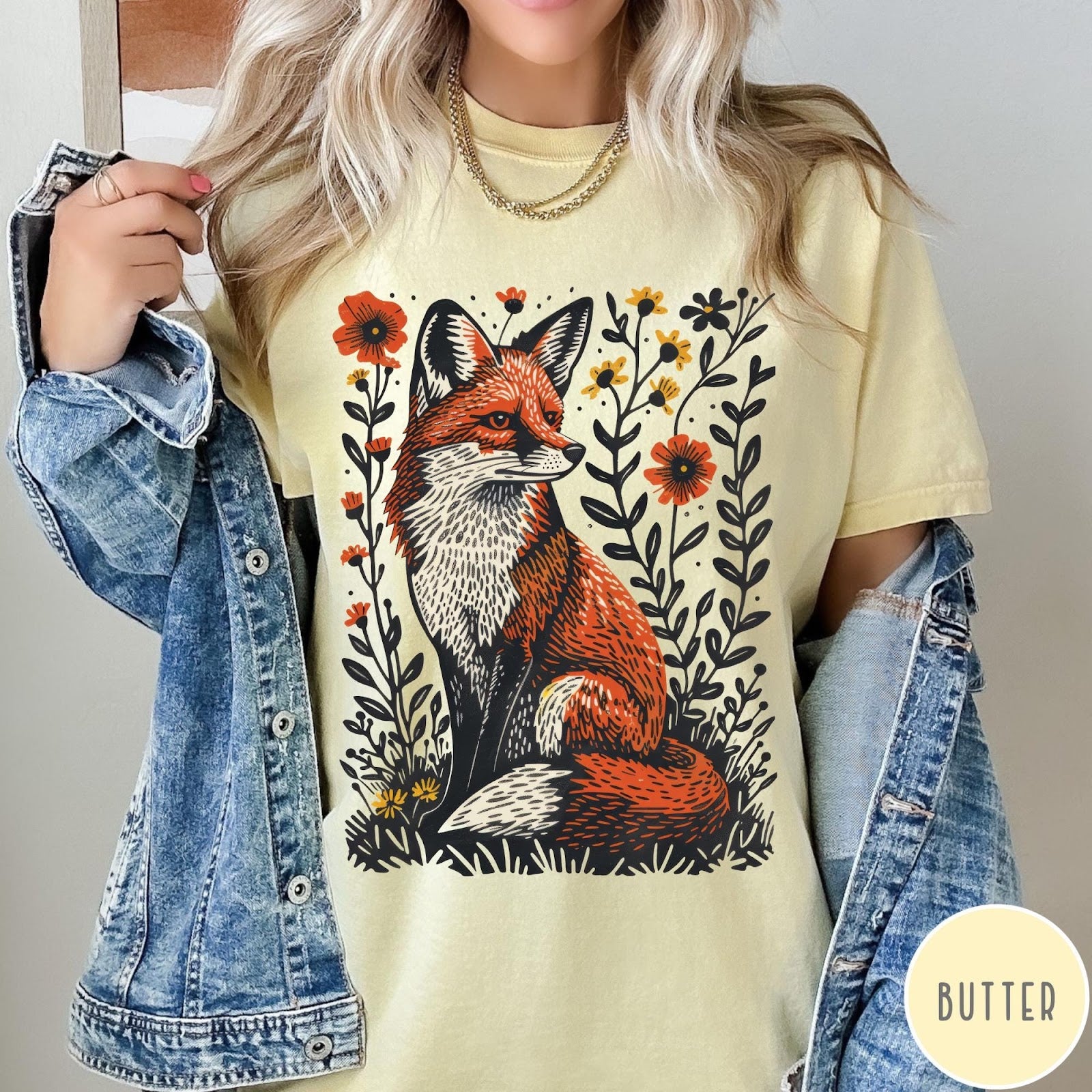 Comfort Colors tee in Butter featuring vintage style graphic of a sitting fox surrounded by orange flowers