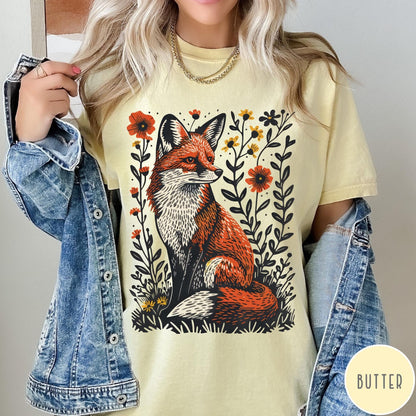 Comfort Colors tee in Butter featuring vintage style graphic of a sitting fox surrounded by orange flowers