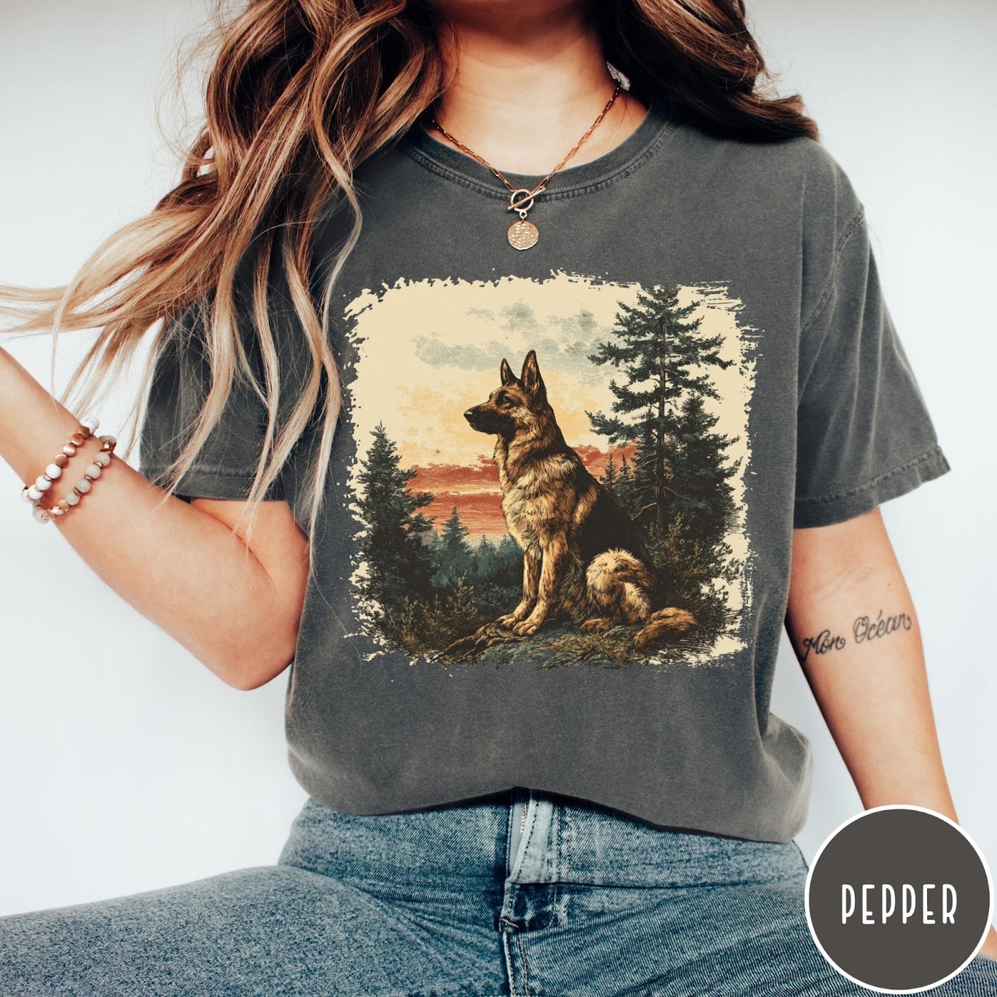 Comfort Colors tee in Pepper featuring vintage style graphic of a German Shepherd sitting in a forest