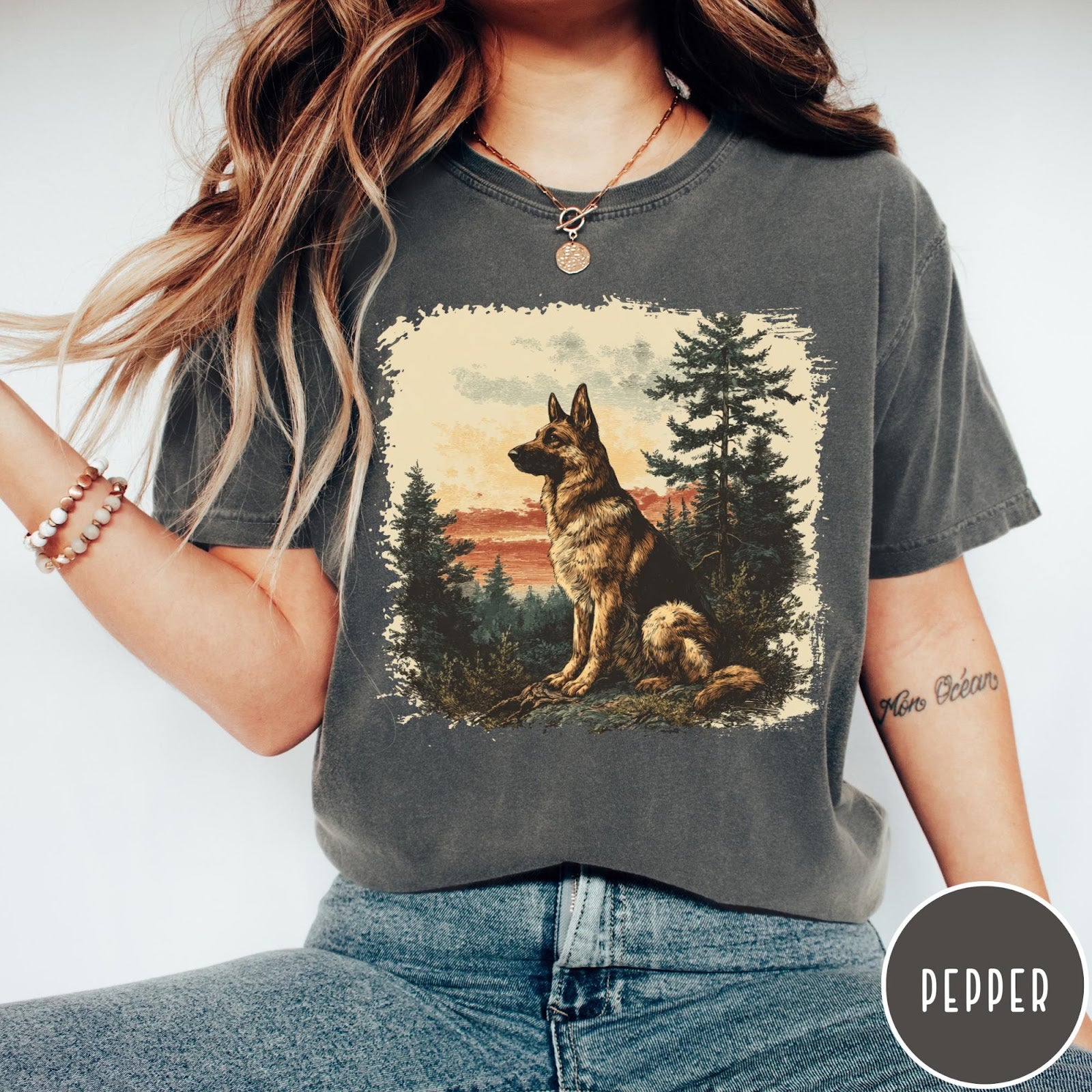 Comfort Colors tee in Pepper featuring vintage style graphic of a German Shepherd sitting in a forest