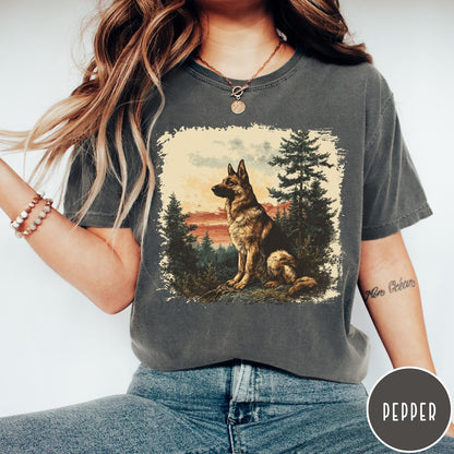 Comfort Colors tee in Pepper featuring vintage style graphic of a German Shepherd sitting in a forest
