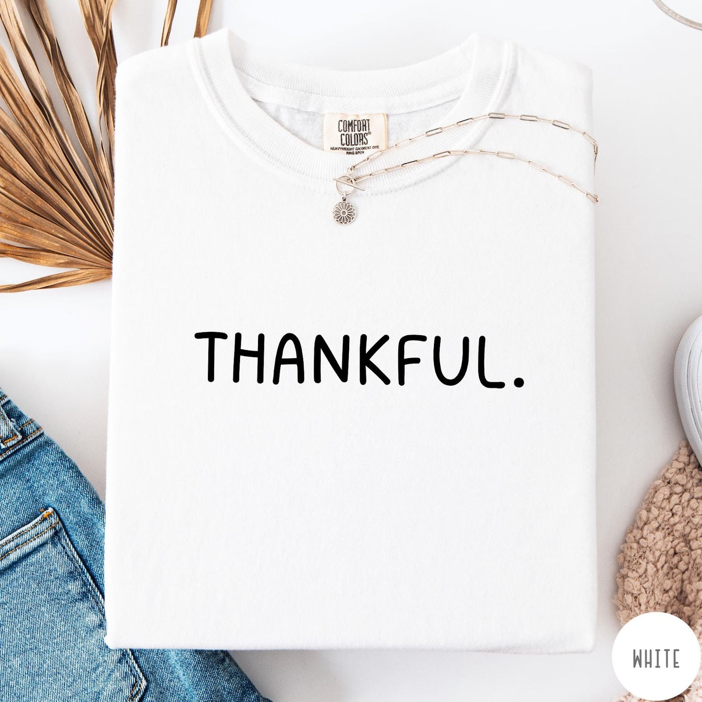 Comfort Colors tee in White featuring minimalist style with the word Thankful printed in black text
