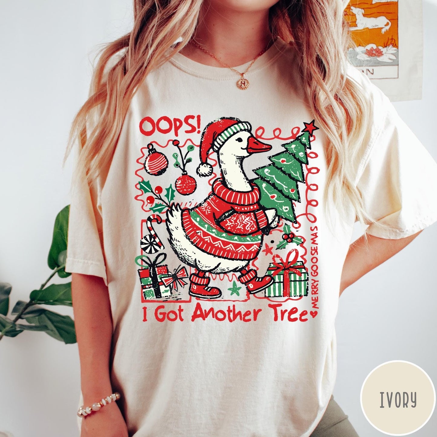 Comfort Colors tee in Ivory featuring festive graphic design of a goose wearing a sweater and hat