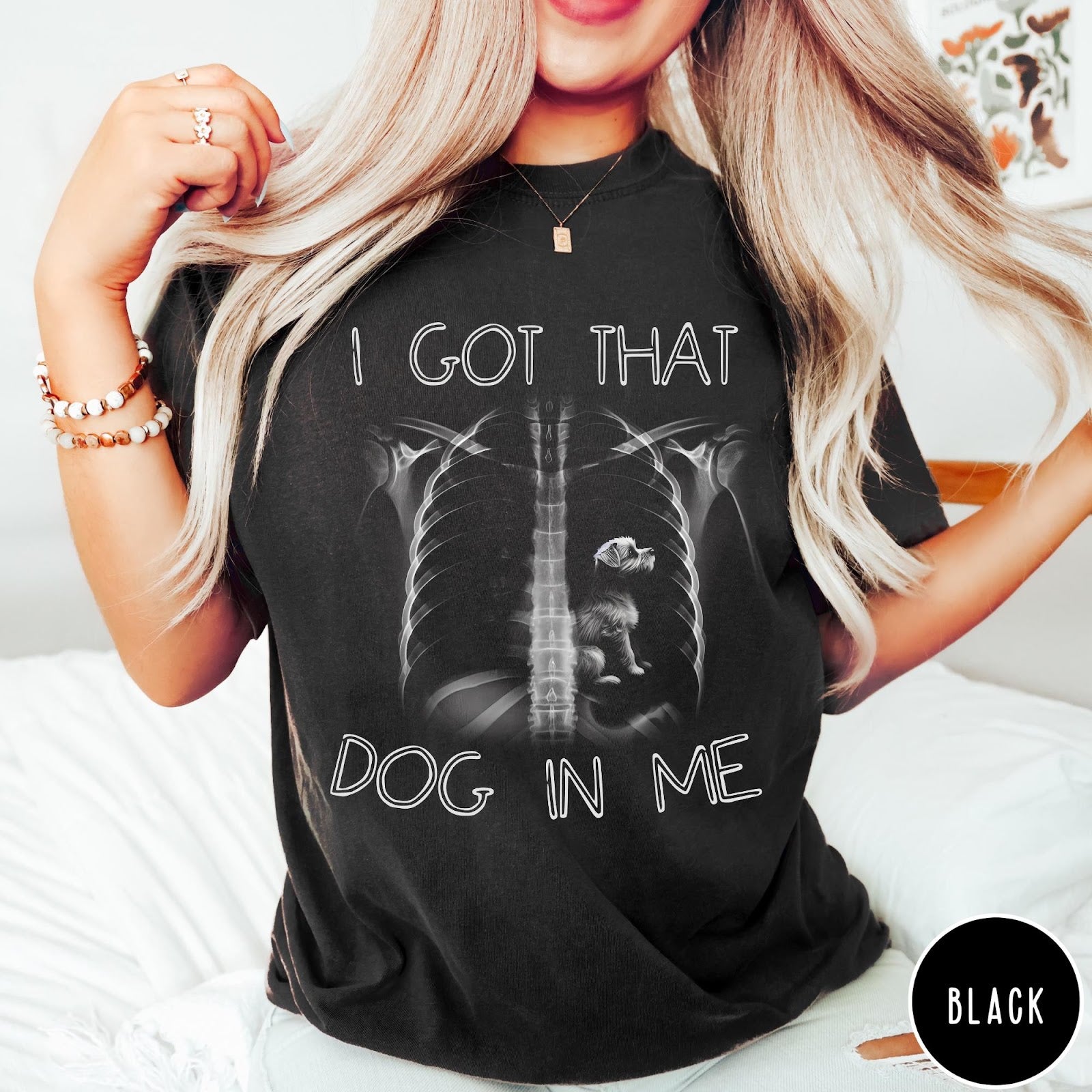 Comfort Colors tee in Black featuring graphic style X-ray ribcage with a small dog sitting inside.