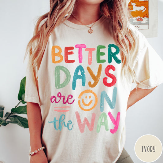 Comfort Colors tee in Ivory featuring optimistic typography with Better Days Are On The Way graphic text