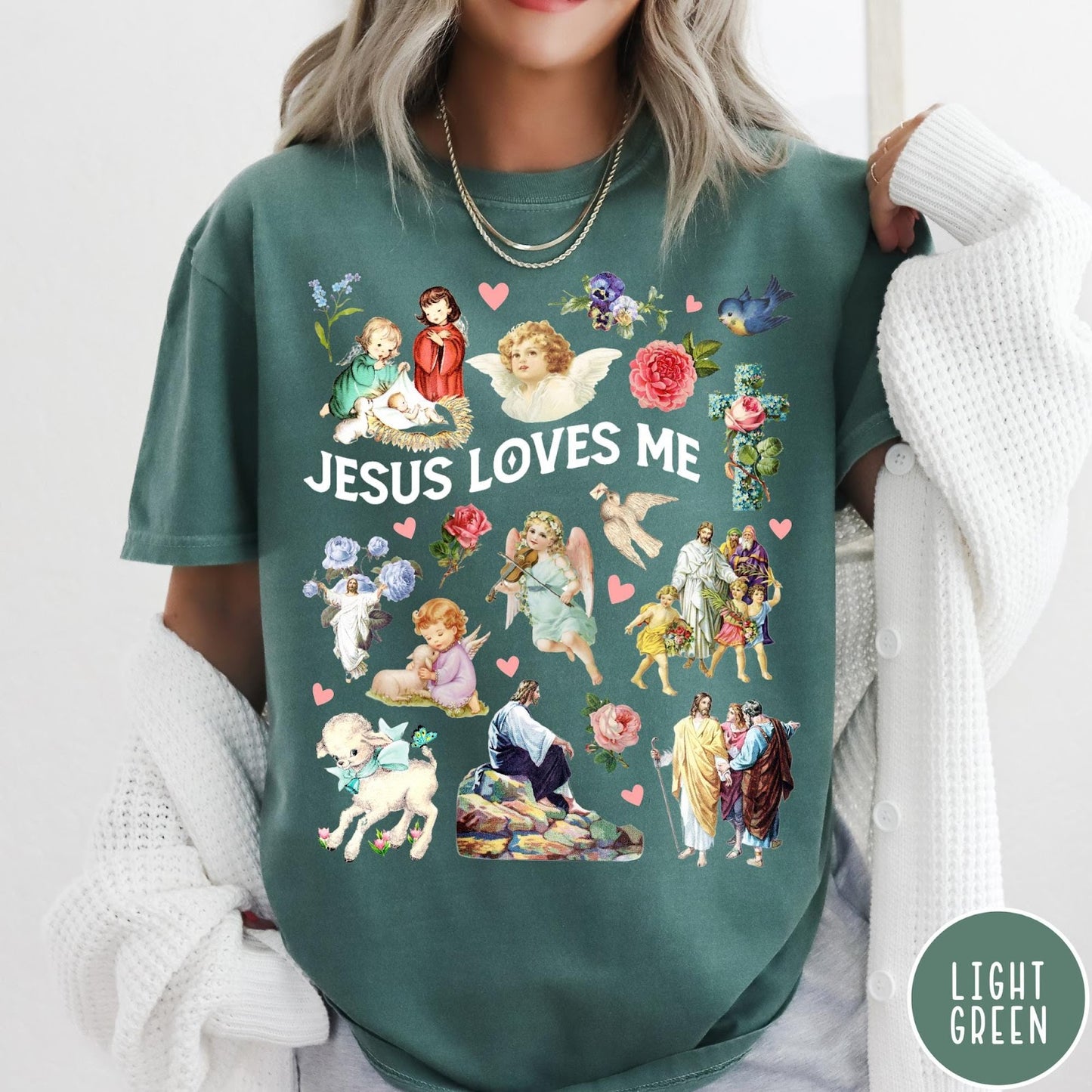 Comfort Colors tee in Light Green featuring vintage religious style graphic with Jesus, angels, lambs, and floral elements