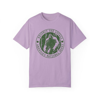 Comfort Colors tee in Orchid featuring circular graphic design with Bigfoot and Respect the Locals text