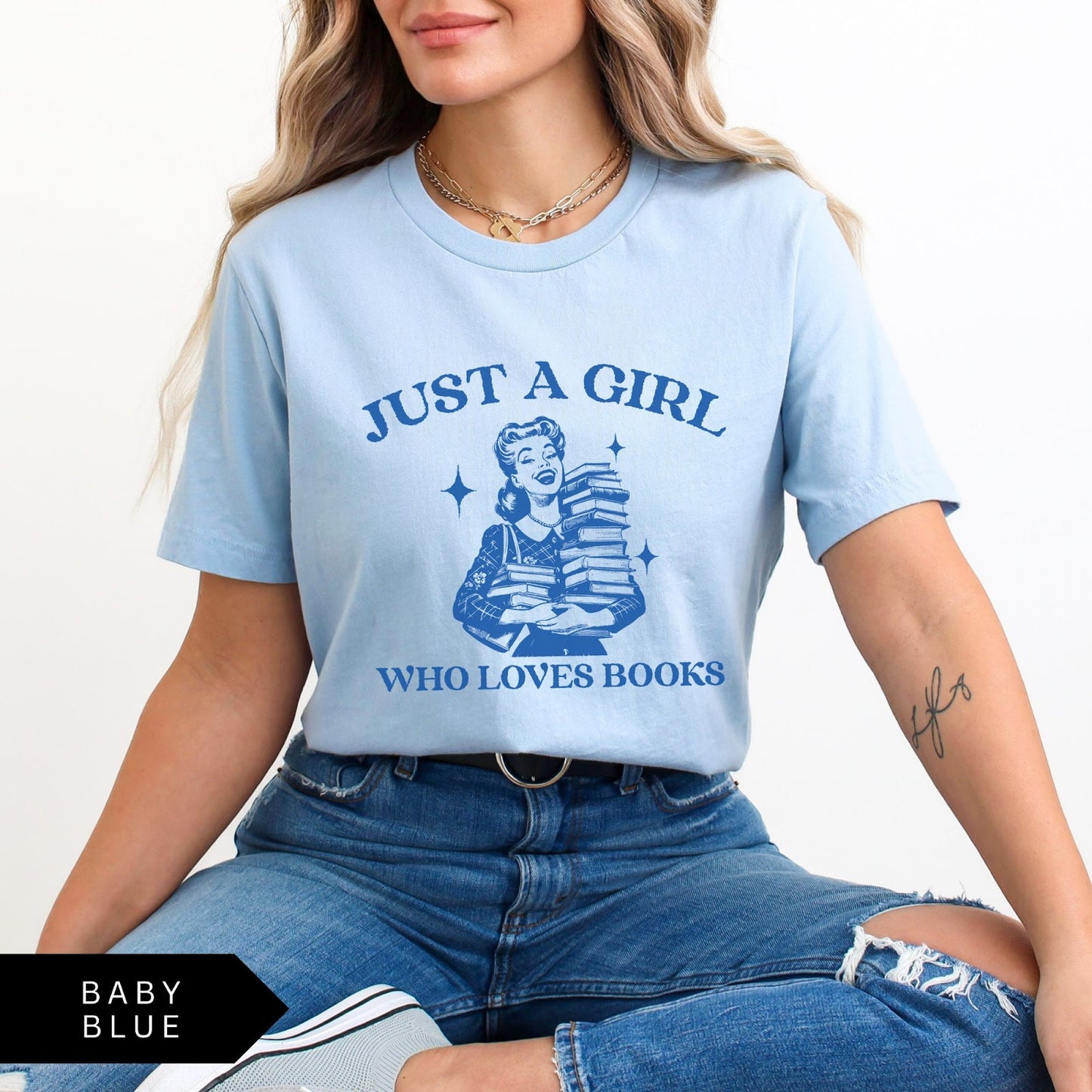 Comfort Colors tee in Baby Blue featuring vintage style graphic of a girl holding a stack of books