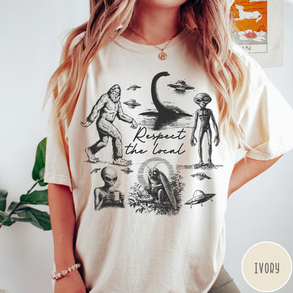 Comfort Colors tee in Ivory featuring vintage style graphic of Bigfoot, Loch Ness Monster, aliens, and UFOs
