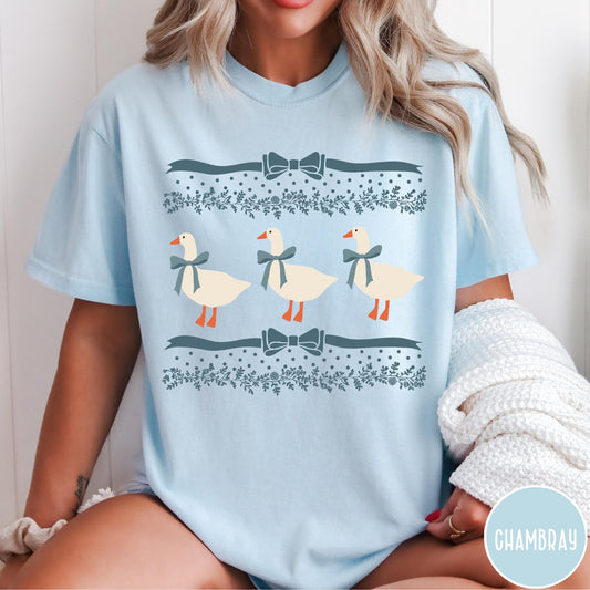 Comfort Colors tee in Chambray featuring vintage style graphic with three geese wearing blue ribbons and floral borders