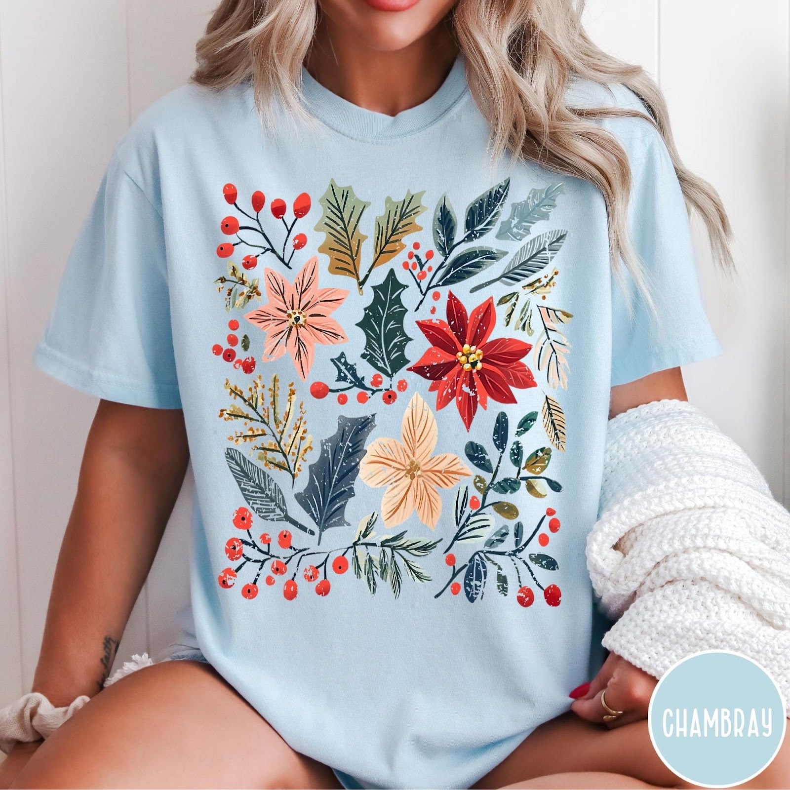 Comfort Colors tee in Chambray featuring winter florals graphic with poinsettias, holly leaves, and red berries.