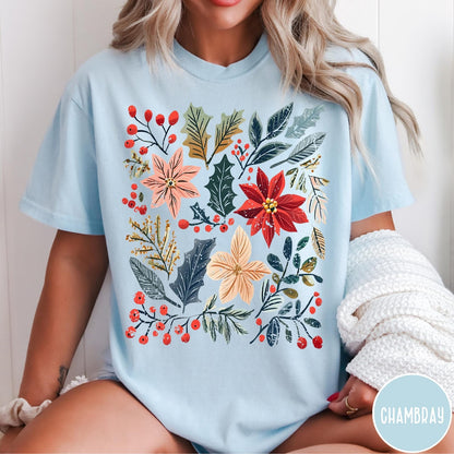 Comfort Colors tee in Chambray featuring winter florals graphic with poinsettias, holly leaves, and red berries.