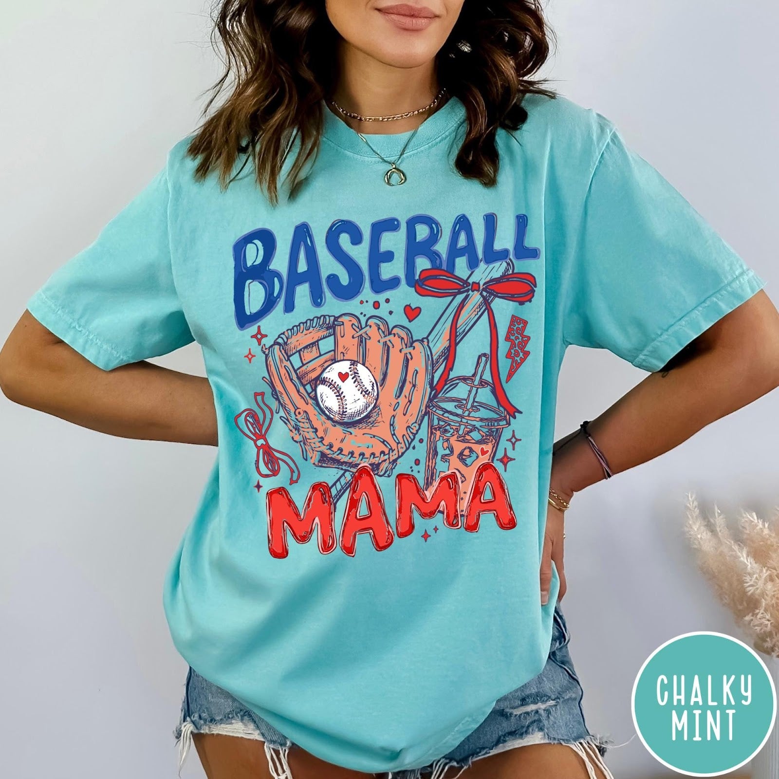 Comfort Colors tee in Chalky Mint featuring baseball design with glove, ball, iced coffee, and red bow graphic