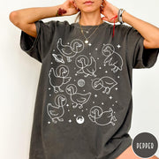 Comfort Colors tee in Pepper featuring line art graphic of multiple geese wearing astronaut helmets in space