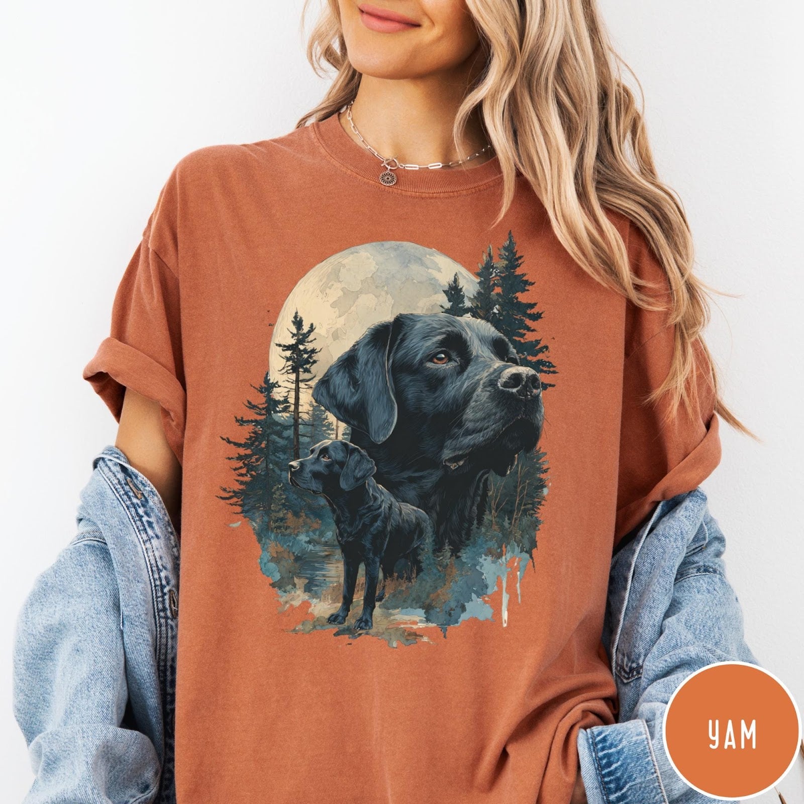 Comfort Colors tee in Yam featuring artistic graphic of Black Labrador dogs in a forest moon setting