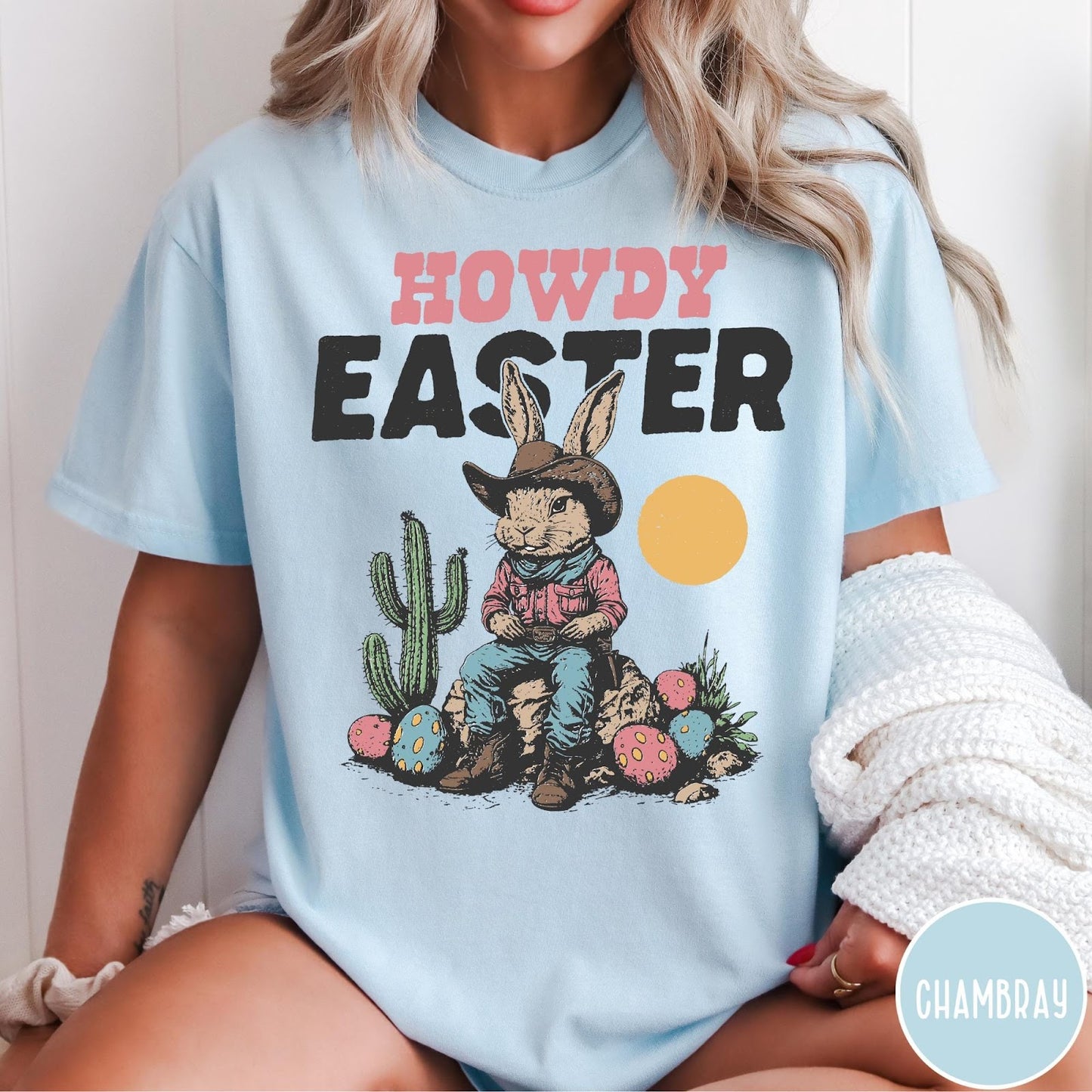 Comfort Colors tee in Chambray featuring western design style cowboy bunny sitting on a rock with cactus