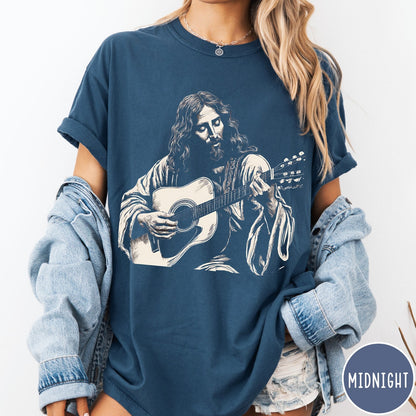 Comfort Colors tee in Midnight featuring vintage style graphic of Jesus playing an acoustic guitar