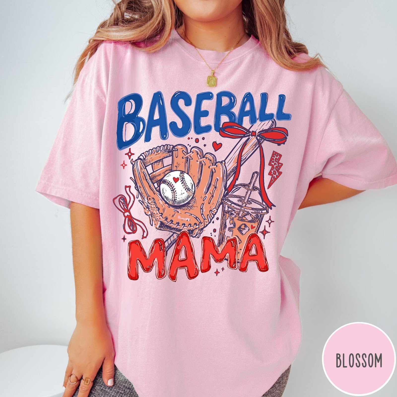 Comfort Colors tee in Blossom featuring baseball graphic with glove, iced coffee, and red bows