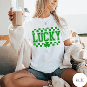 Comfort Colors tee in White featuring checkerboard design with Lucky text and a shamrock graphic