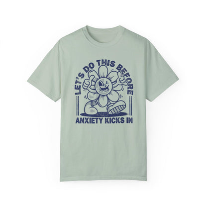 Comfort Colors tee in Bay featuring retro graphic style winking flower character with anxiety text design
