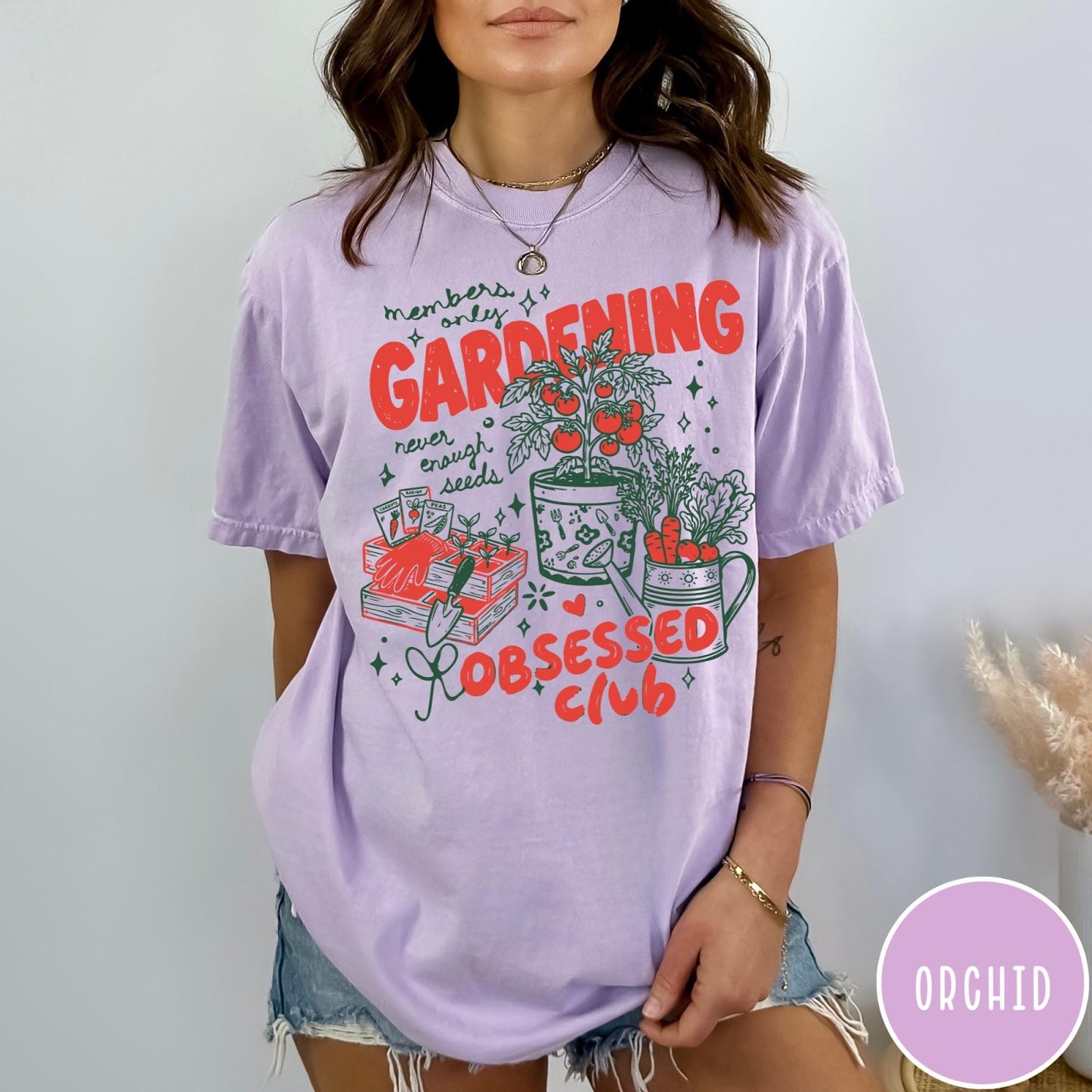 Comfort Colors tee in Orchid featuring retro graphic gardening design with tomato plant, seeds, and gardening tools