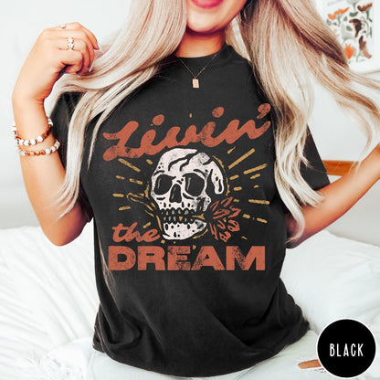 Comfort Colors tee in Black featuring vintage style skull graphic with Livin the Dream text design