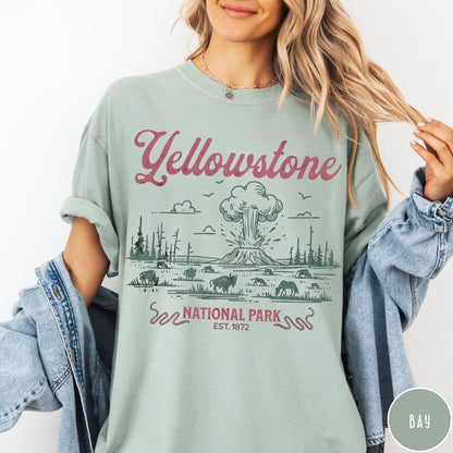 Comfort Colors tee in Bay featuring retro graphic design of Yellowstone National Park with bison and geyser