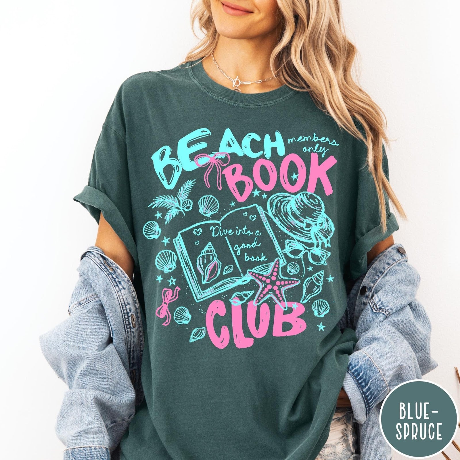 Comfort Colors tee in Blue Spruce featuring beach book club graphic with open book, shells, and hat